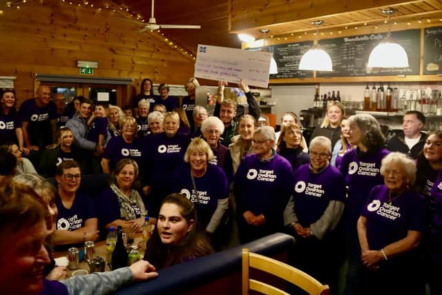 Fundraisers and supporters with the cheque for Target Ovarian Cancer, presented at Sandside Cafe in Sandsend. picture: Alastair Smith