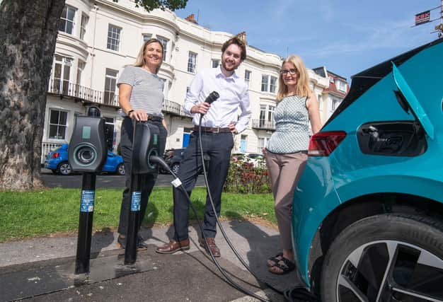 : From left, Kellie Lane, account manager at Connected Kerb, Harry Baross, climate change manager at North Yorkshire Council, and Jane Wilson, deputy parking manager at North Yorkshire Council. They are stood in Albion Road car park in Scarborough, where electric vehicle chargers have been installed.