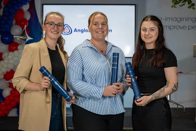 From left, Megan Neale, Ella Higham and Hayley Lovie celebrate their graduation.