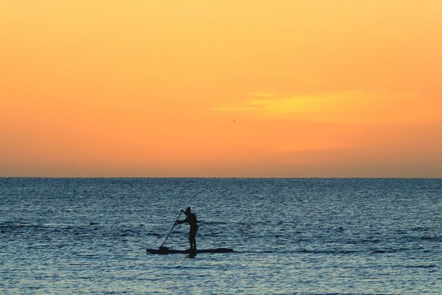Lone paddle boarder.