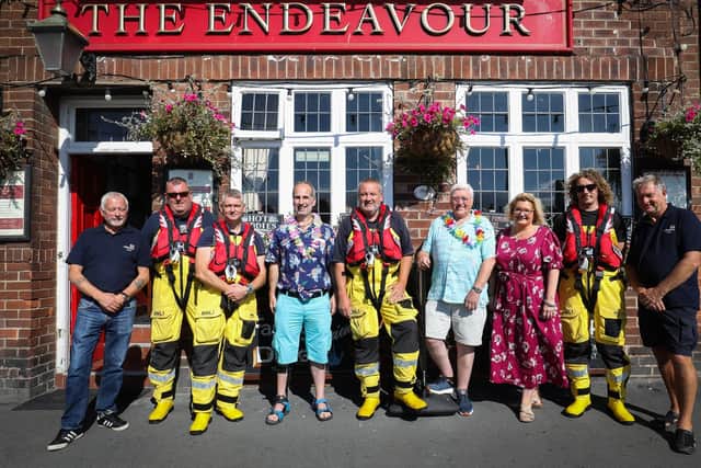 Volunteers from Whitby RNLI at the Endeavour pub in Whitby with landlady Maria Taylor and fundraisers Jim Mageean and Graeme Knight.
