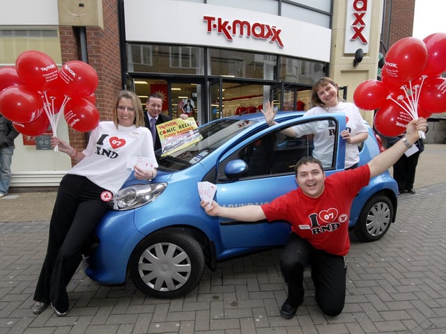 TK Maxx Scarborough store raffles a Peugeot 107 car to raise money for Red Nose Day charity. TK Maxx staff Kerry Tweddle (L), Stuart Goodworth, and Emma Ashby, with David Ward (back), sales exec' with Arundales Peugeot dealer. 070838b