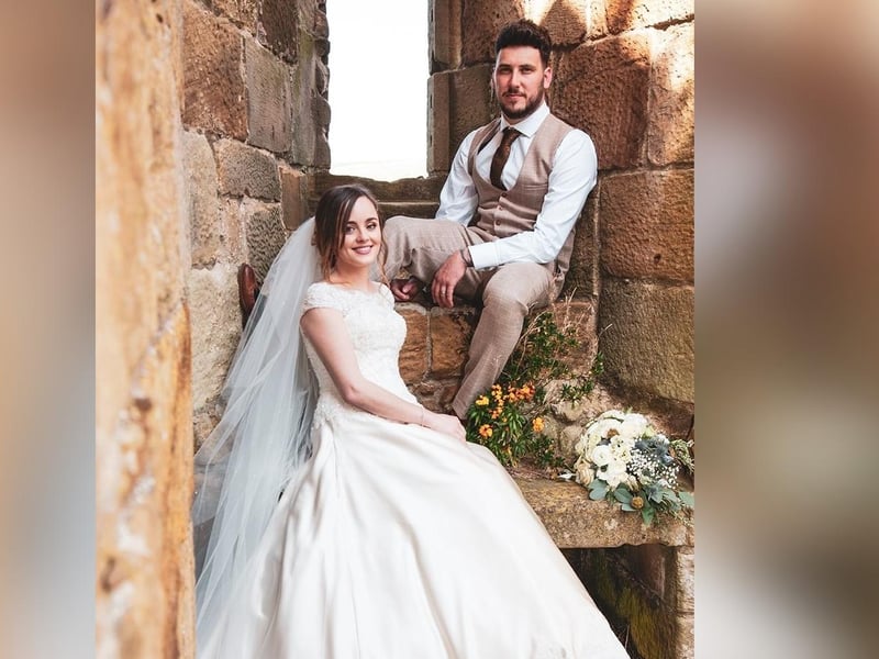 Happy couple celebrate wedding at Danby Castle.
picture: Discovery Photography.
