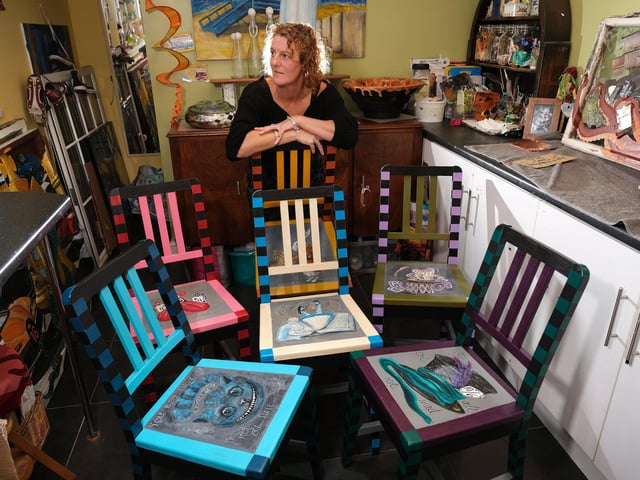 The six Alice in Wonderland themed chairs look magnificent together