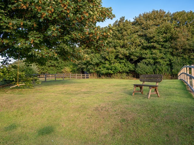 The rear garden of the cottage stretches up to Mulgrave Woods and has exceptional sweeping views of the coastline.
