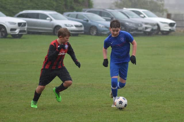 Heslerton Hunters U12s, blue kit, earned victory. Photo by Cherie Allardice