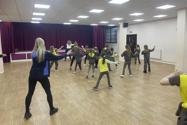 The girls try their hand at Indian dancing