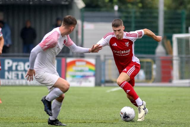 Defender Alex Brown looks to get past a Selby player.