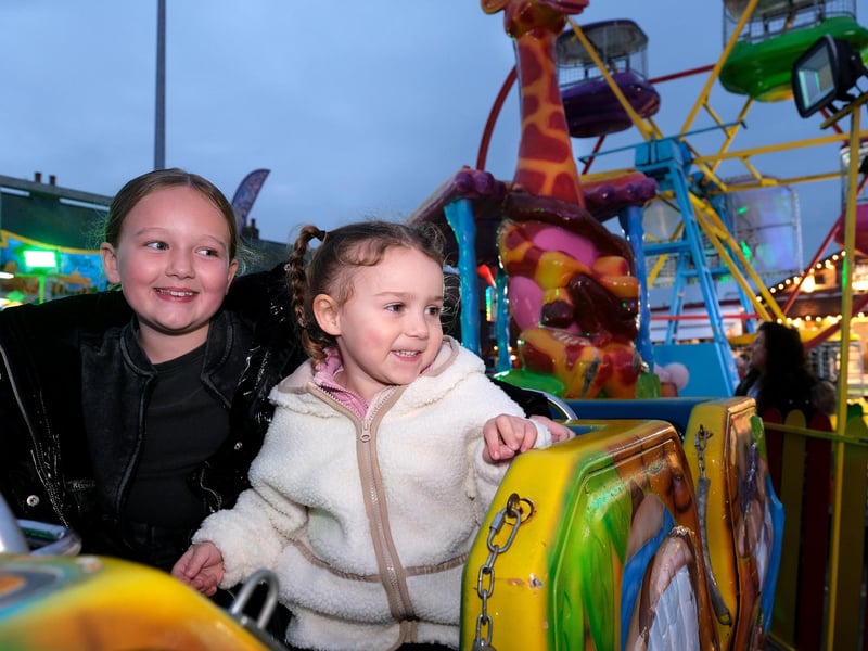 Two gorgeous girls having a ball trying out the rides.