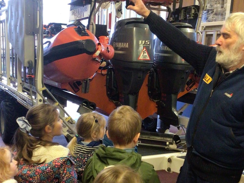 Youngsters are shown around the lifeboat shed in Staithes.