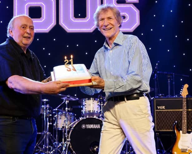 Paul Jones (right) presents Whitby 60s Promoter Chris Wood with a 21-year anniversary cake on stage at the Whitby Pavilion during the festival. photo: Goffy Media