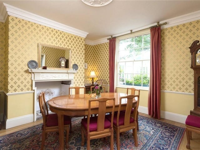 Another well lit dining or reception room with garden views.