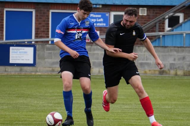 A Whitby Town XI, blue kit took on RAF Fylingdales in an entertaining contest. Photo by Owen Cox