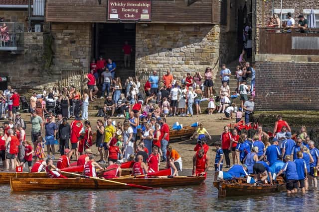 Friendship and Fisherlads rowing teams. photo: Brian Murfield