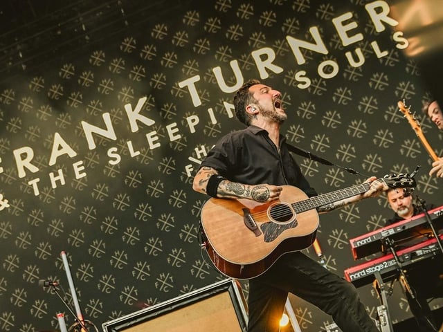 Frank Turner fired up and striding across the Open Air stage.