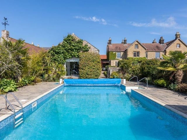 The outdoor heated pool in its 'tropical' courtyard setting.