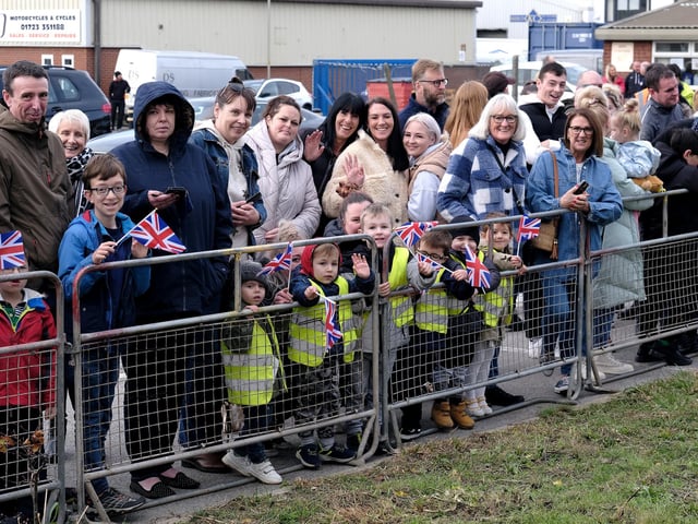 A good-natured crowd awaits the Royal visitors