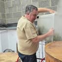 Three Bs Micropub owner Mark Bates adds the hops for 1,000th brew.