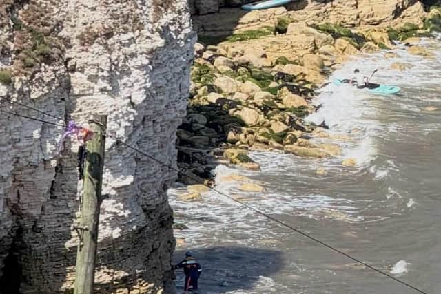 With the tide continuing to rise, a rescue plan was developed to safely evacuate everyone from the rocks. Photo: HM Coastguard