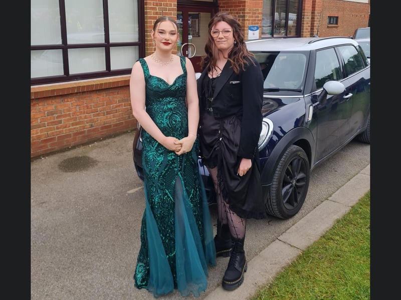 Beautiful duo in dark dresses.
