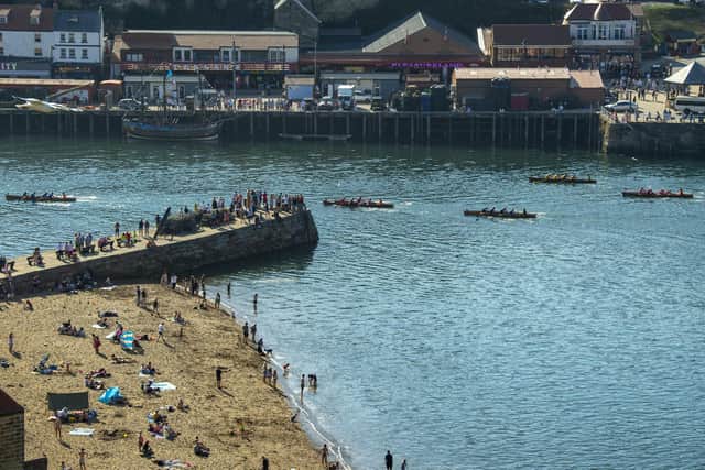 Rowers race through the harbour during the Whitby Regatta. 
Picture Tony Johnson