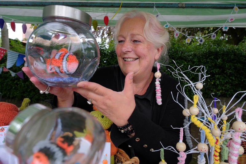 Babs Binder with her cuddly fish in a jar for sale.