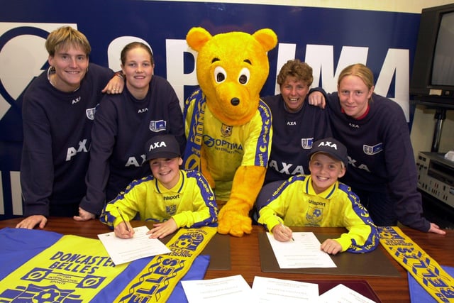 Two 11 year olds sign for the Doncaster Belles, they are, seated left Vikki Stevens, from Goole and Vicky Frisby, from East Markham, nr Retford. Watched by, from the left, Kaz Walker, Vicky Exley, Donny Bear, Gill Coultard and Leanne Hall.