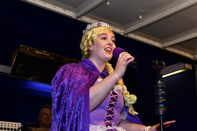 Singing on stage from the YMCA Panto Princess