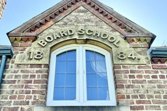 A reminder of the property's past as a school, dated 1884.
