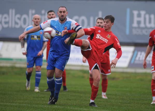 Bridlington Town's Alex Markham at full stretch during their home win against Winterton Rangers on Saturday.