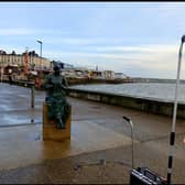 Brave-hearted Graham Robinson taking a freeing shower on Bridlington seafront to raise money for Macmillan.
