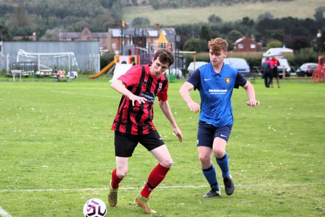Declan Richardson, red and black kit, set up West Pier Reserves' first goal in their loss to Seamer