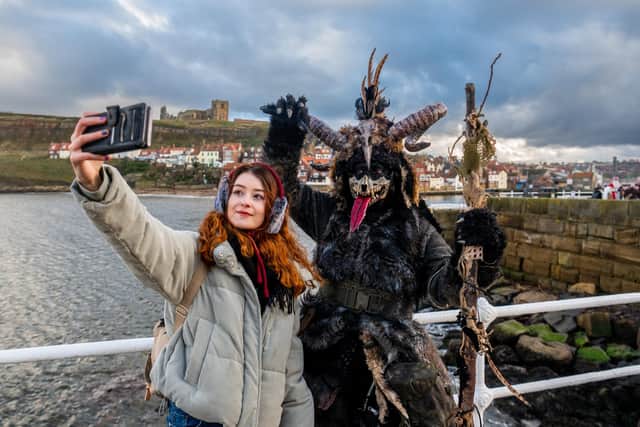 A selfie for spectators at the Krampus Run - pictured (right) Jennie Trowbridge, of Stockton-on-Tees, having a selfie with her daughter Maria.
Picture: James Hardisty.