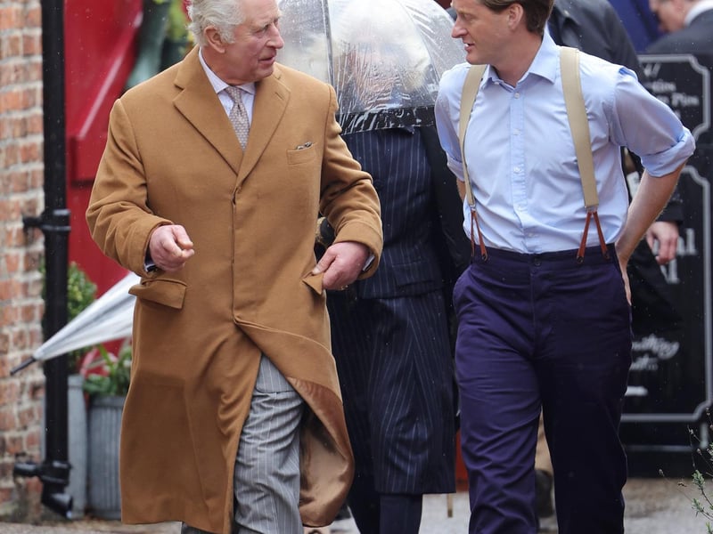 King Charles III talks to one of the local food producers.