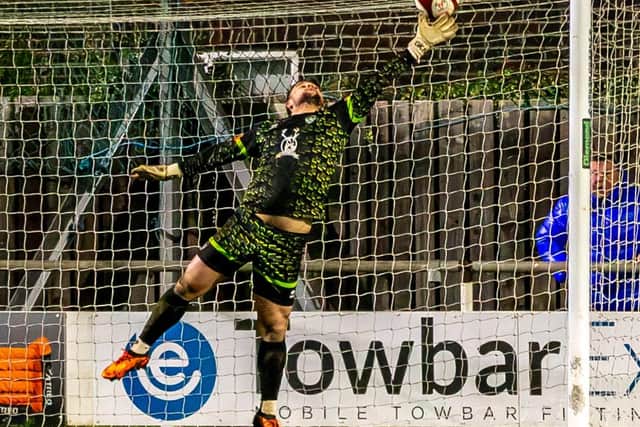 Town keeper Shane Bland pulls off one of several outstanding saves against Lancaster City. PHOTOS BY BRIAN MURFIELD