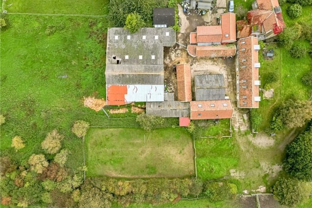 An aerial view of the farmhouse and buildings that include six potential holiday lets.