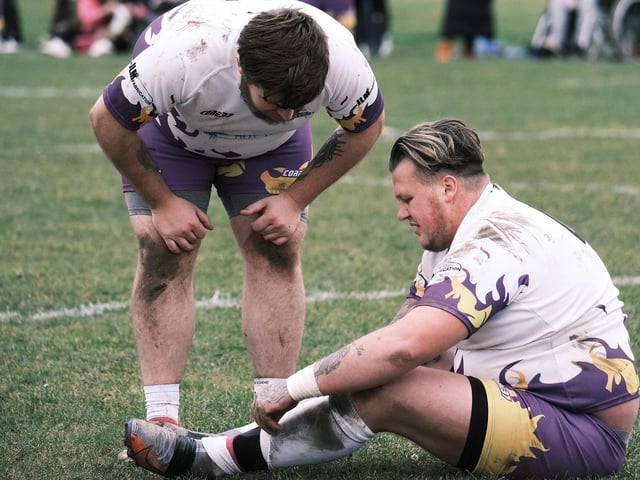 A Pirates player checks on his team-mate