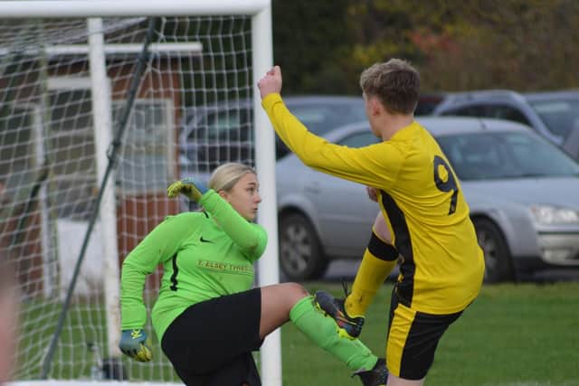 Heslerton Under-14s' keeper in action against Scalby Under-14s