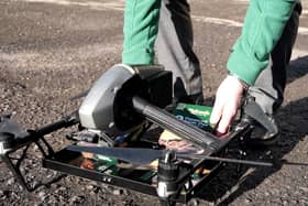 Loading up the Holland's pies on the drone for delivery (photo: Ben Frith)