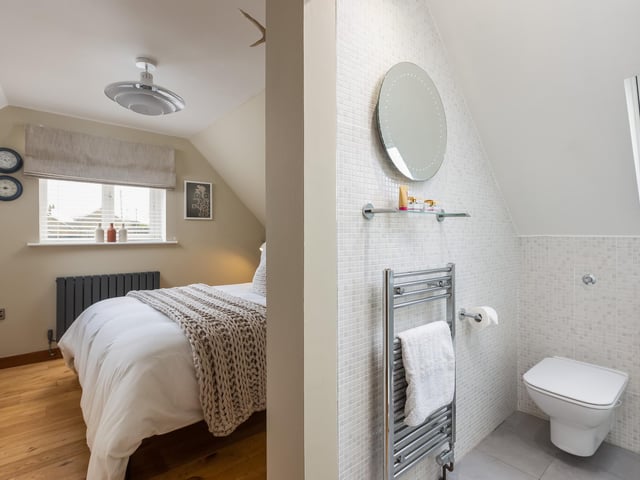 The bedroom with en suite facility.