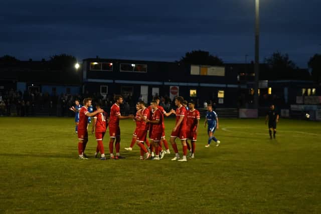 Brid Town players celebrate the opener scored by Michael Coulson. Photo by Bailey Beaden