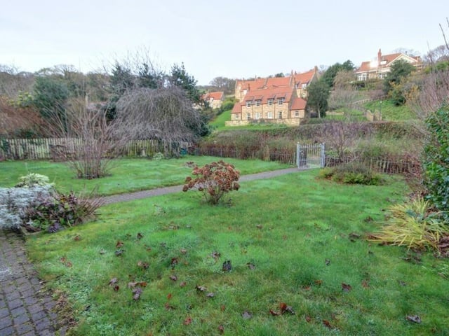 The cottage has extensive gardens and is just a short stroll to the beach.
