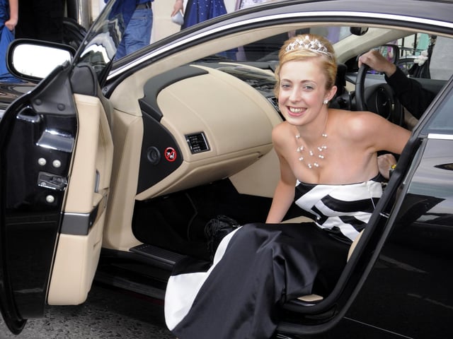 Brooklyn Webster arrives for the St. Augustine's School prom by Aston Martin.