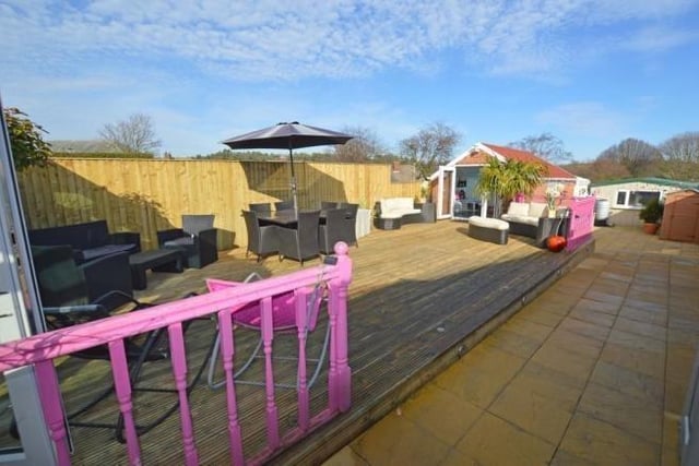 This rear decked area with spa pool enclosure is a large space ideal for entertaining.
