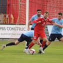 Bridlington Town striker Lewis Dennison tries to force his way through the Worksop Town defence in Saturday's clash at Queensgate. PHOTOS BY DOM TAYLOR