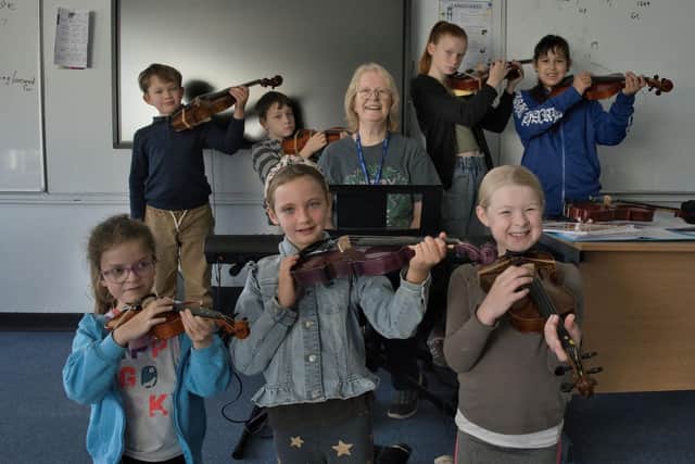 Seven new young violinists at Whitby Music Centre. Back row: Arthur, Finley, Isabel and Laura; front: Aubree, Ari and Lexie, pictured with teacher Sue Rowland.