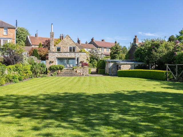 Looking up towards the rear of the property in its village setting.