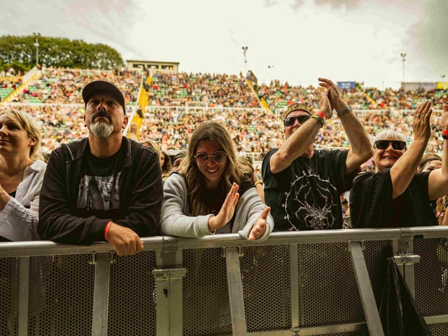 Fans enjoying the gig at the barrier.