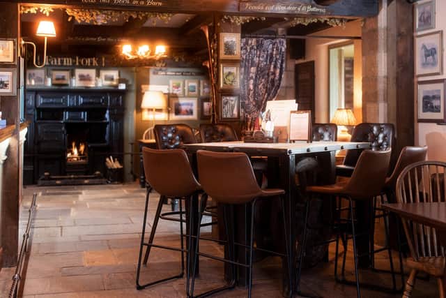 A warming open fire, perfect for warming next to at The Stable