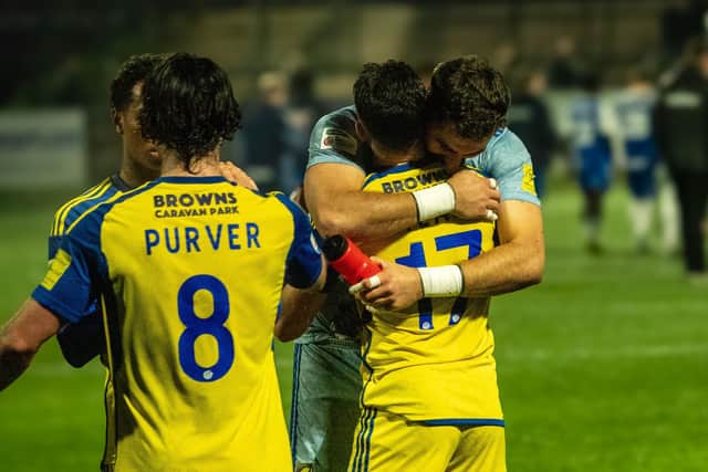 Boro man of the match, keeper Ryan Whitley, celebrates the win with scorer Dom Tear, no 17. Photo by Chris Marson